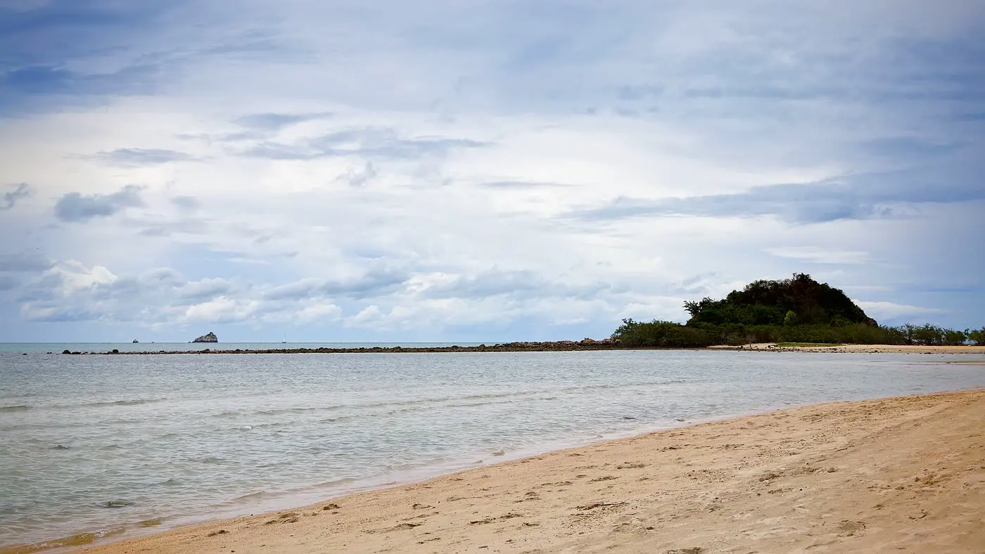 Choeng Mon Beach, a sheltered bay with long-tail boats at the water’s edge
