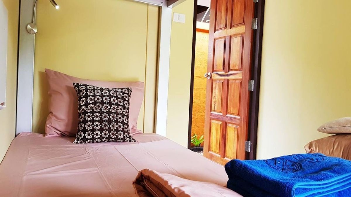 Baan Hinlad Home and Hostel pool and grounds in Nathon