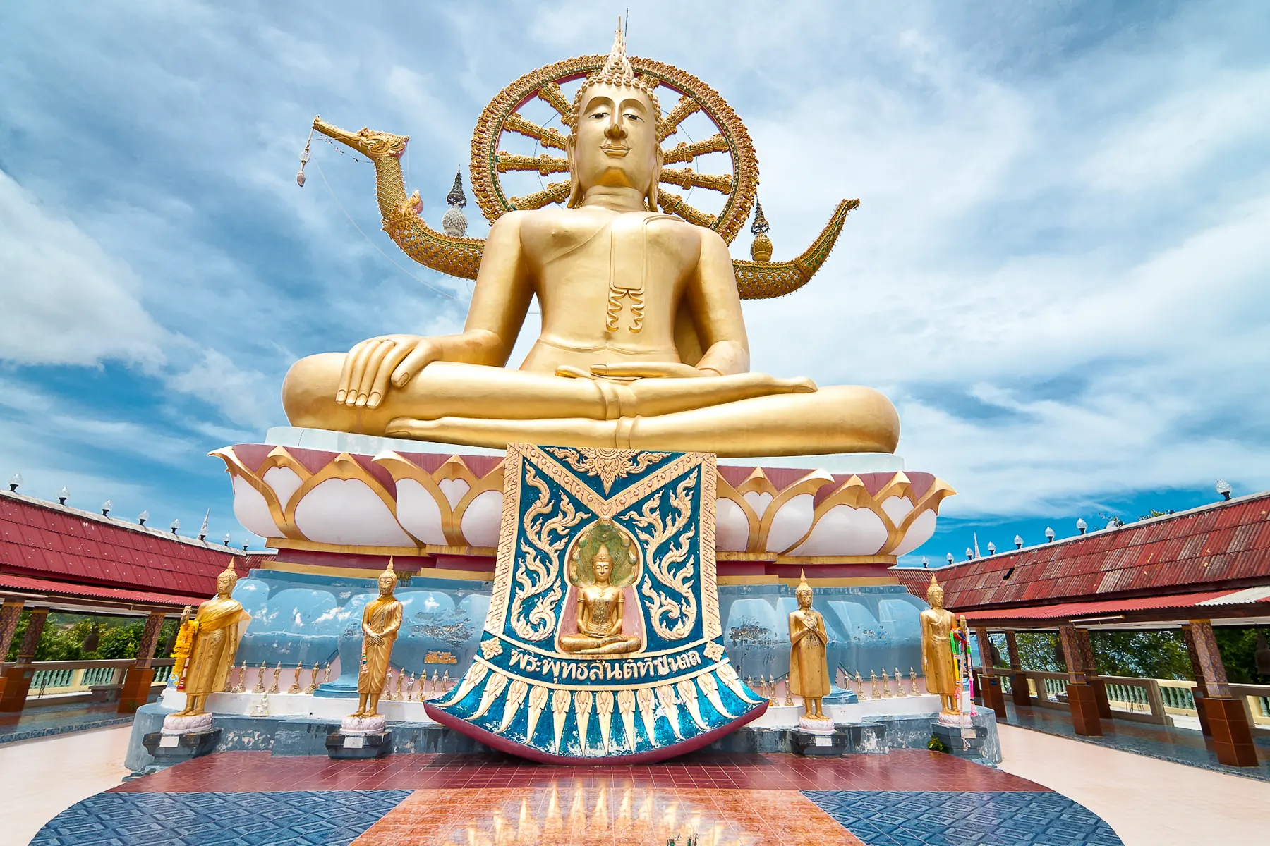 The golden Big Buddha at Wat Phra Yai on Koh Samui, with the gulf behind the statue